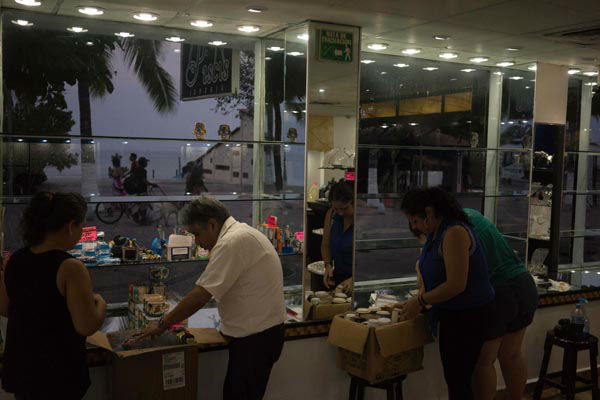 People preparing for the arrival of hurricane Patricia box their merchandise at a seafront jewelry shop in the Pacific resort city of Puerto Vallarta, Mexico. <span class=meta>AP Photo/ Cesar Rodriguez</span>