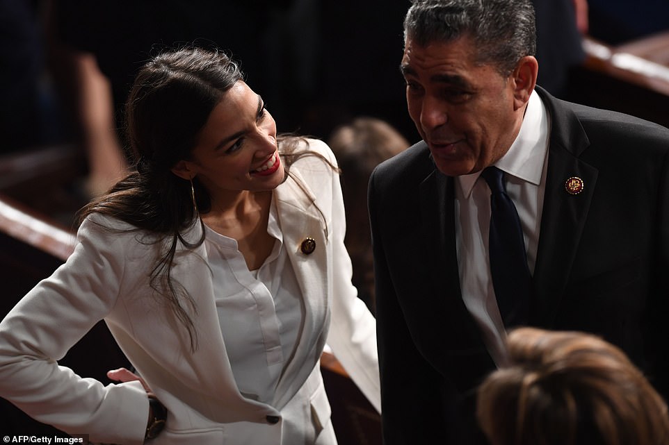 Meet the neighbor: Alexandria Ocasio-Cortez greets Adrian Espaillat, who represents the 13th district of New York, which adjoins her 14th district. He is the first former undocumented immigrant in Congress