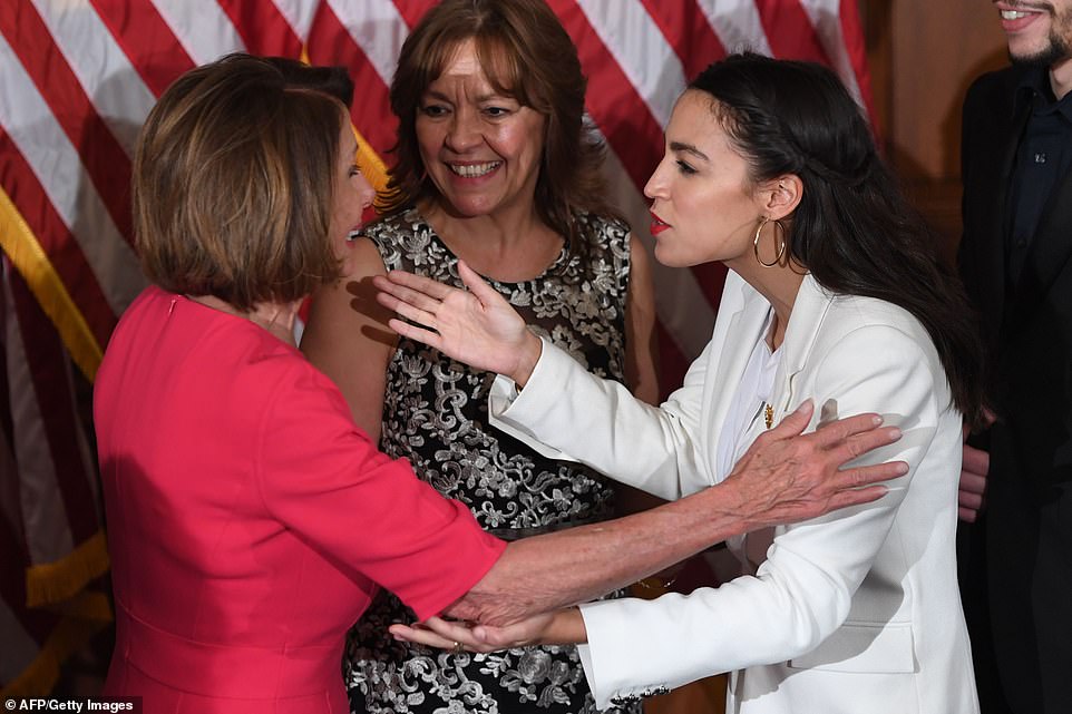 Greeting: Alexandria Ocasio-Cortez hugged Nancy Pelosi before the new Democratic speaker ceremonially swore in the New York congresswoman 